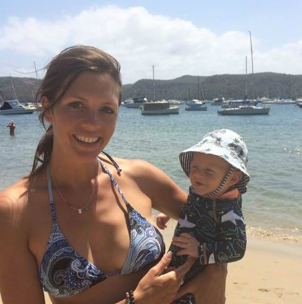 Woman on beach with baby